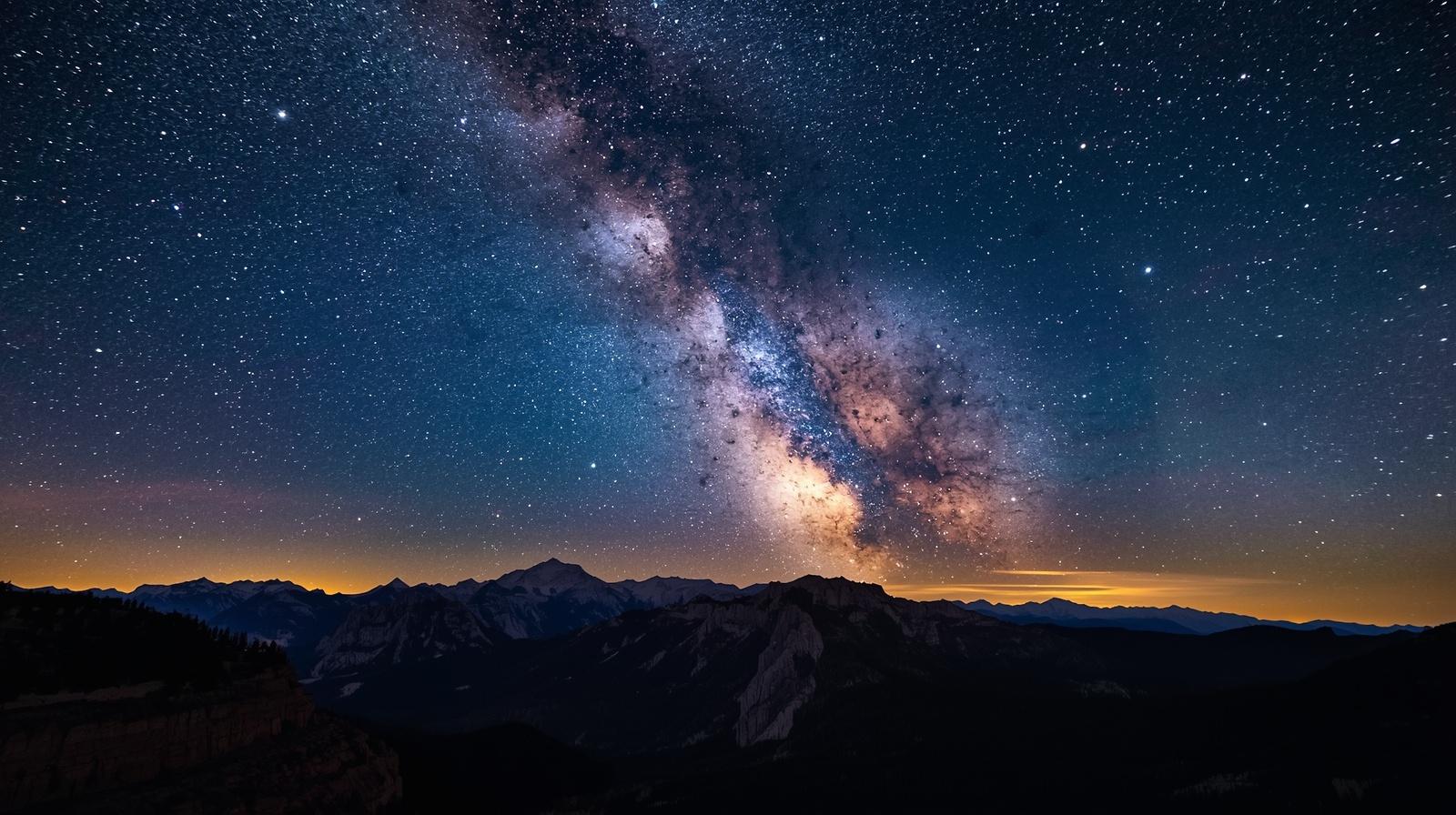 Stargazing in Colorado at Rocky Mountain National Park night sky showing the Milky Way