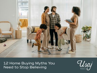 A family with two young children stand next to a realtor in a potential home they would like to buy. Below, white text over a dark gray background reads "12 Home Buying Myths You Need to Stop Believing" next to the Usaj Realty logo.