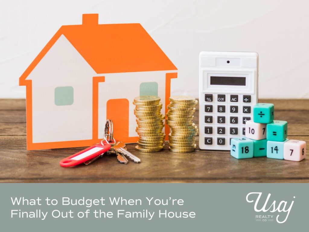 A photo of an paper orange house, keys, coins stacked, a calculator, and dice stacked sits above white text on a gray background that reads, "What to Budget When You’re Finally Out of the Family House" next to the Usaj Realty logo in white.