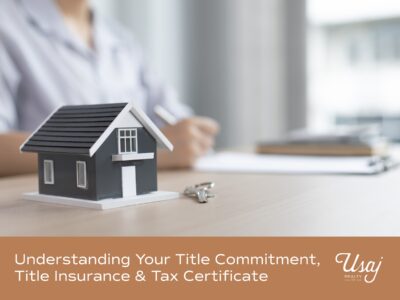 A photo of a small house with keys resting on a desk in the foreground, and a person writing on a clipboard. Below the photo, white text on an orange background readsn "Understanding Your Title Commitment, Title Insurance & Tax Certificate" next to the Usaj Realty logo in white.