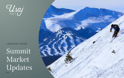 A graphic with a semi circle photo of a person skiing down a mountain. The white text on a the gray gradient background reads, "January 2026, Summit Market Updates."