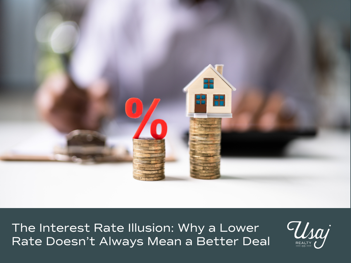 A photo of coins stacked with a percentage symbol (%) and a small home sits above text that reads, "The Interest Rate Illusion Why a Lower Rate Doesn’t Always Mean a Better Deal" for a blog discussing the cost of waiting to buy a home.