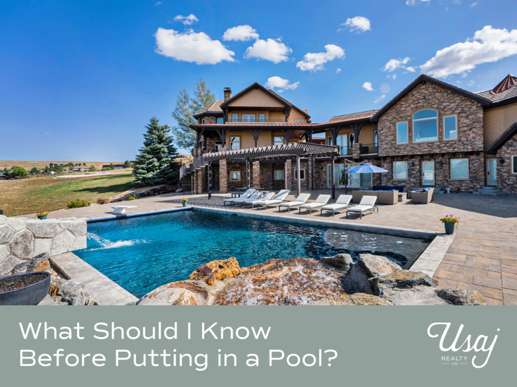 A mountain home with a large pool sits above white text on a sage background that reads, "What Should I Know Before Putting in a Pool?"