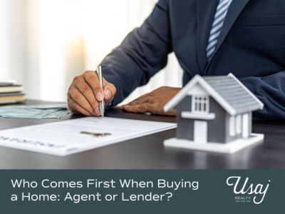 A photo of a realtor reading a document with a miniature house on a desk sits above white text on a sage background that reads, "Who Comes First When Buying a Home: Agent of Lender"