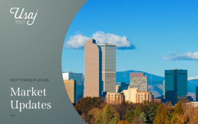 White text on a gray background reads, "September 2026 Market Updates" with the Usaj Realty logo in white in the upper left hand corner. To the right, a photo of the skyline of Denver in September shows the buildings of downtown and some trees below.